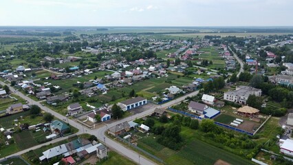 Fototapeta na wymiar Summer photo of a green village from quadrocopter