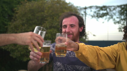 Diverse group of friends toasting celebration with drinks clinking beverages