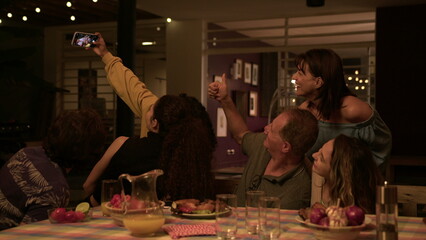 Group of friends taking selfie with phone in home backyard barbecue