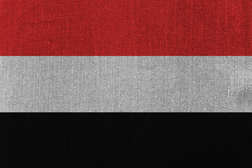 Patriotic classic denim background in colors of national flag. Yemen