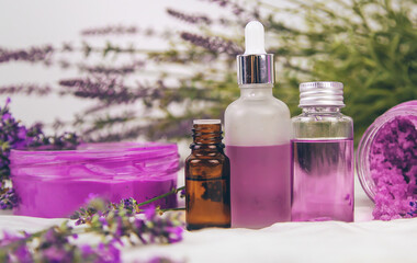 Fototapeta na wymiar Spa cosmetics with lavender extract. Selective focus.