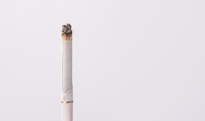 lit cigarette on a white infinity cove background