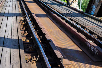 Connecting rails on the viaduct along the tracks. Day.