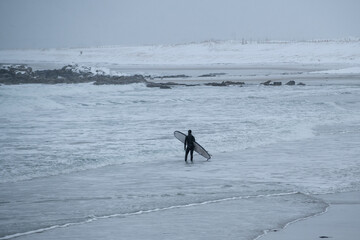 Arctic surfing in icy water