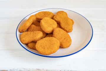 Chicken nuggets on white background.