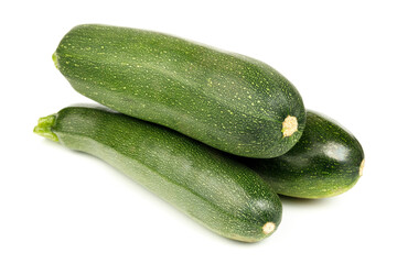 Green zucchini on a white background, ripe vegetables.
