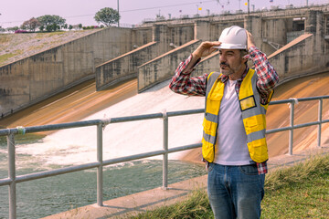 Fototapeta premium A Dam engineering doing his daily routine inspection work.