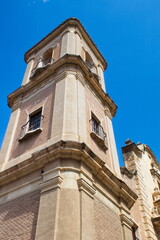 Fototapeta na wymiar Beautiful high tower with bell tower in the baroque church of Santa Eulalia in Murcia