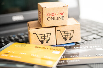 Shopping online box with credit card on laptop computer. Finance commerce import export business concept.