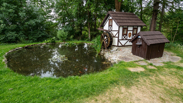 Poustka, Czech Republic / Karlovy Vary Region - 06 24 2022: Seeberg Castle - pond and water mill miniature