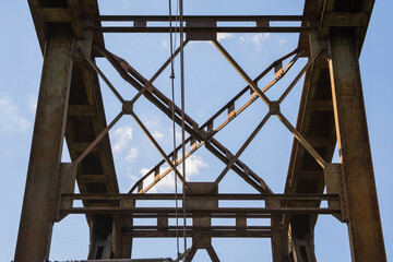 Railway viaduct against the sky and clouds in an unusual wide angle perspective. Day.