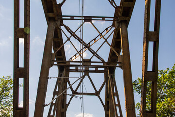 Railway viaduct against the sky and clouds in an unusual wide angle perspective. Day.