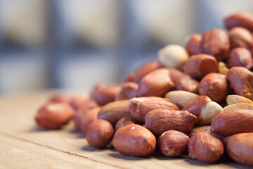 Heap of roasted peanuts, close up. Nuts. Peanuts peeled and fried.