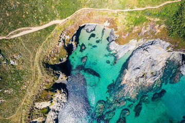 Top Down over Piskies Cove and HMS Warspite Cliffs from a drone, Penzance, Cornwall, England