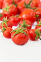 small tomato close-up on the background of a tomato.  Design for supermarket advertising, banner, poster.
