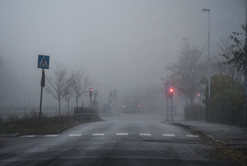 street in a city or town while fog