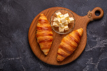 French croissant. Freshly baked croissants with butter
