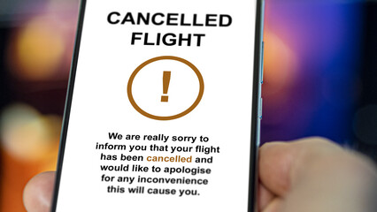 Cancelled flight, a traveler discovers a message from his airline company. His flight is cancelled....