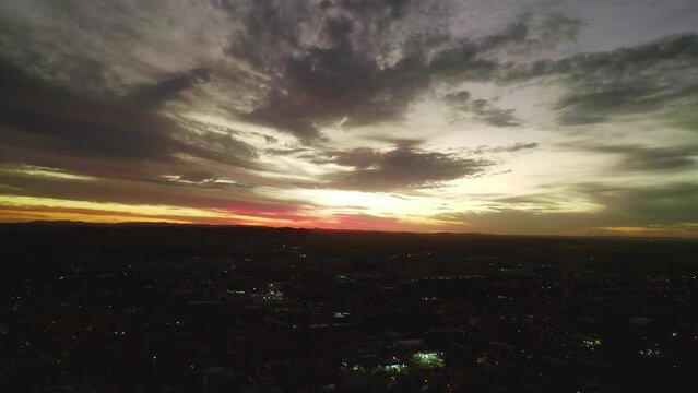 Aerial image of the city of Pirassununga, in the interior of S&atilde;o Paulo, in the Vila Brasil neighborhood, with a view of the sunset and night image of the city
