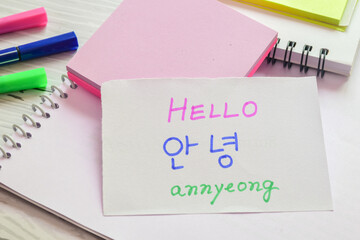 Annyeong; informally saying hello in Korean handwritten in both English and Korean languages...