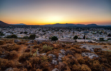 Colorful sunset over village Archangelos in Rhodes, Greece