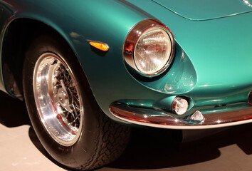 Obraz na płótnie Canvas Retro car close up photo. Beautiful details of vintage auto. Headlight beam close up. 