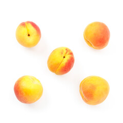 Fresh and juicy apricots on a white background, top view.