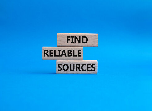 Find reliable sources symbol. Wooden blocks with words Find reliable sources. Beautiful blue background. Business and Find reliable sources concept. Copy space.