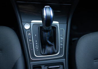 Handle of electric car gearbox control. Design details of minimalist concept of electric car - close-up details of automatic transmission and gear stick. Automatic gear lever and gear shift