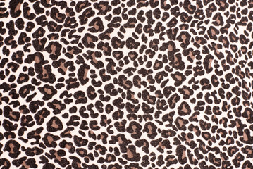 Imitation of the skin of a wild animal leopard or cheetah on the fabric, printing on the fabric with popular leopard spots