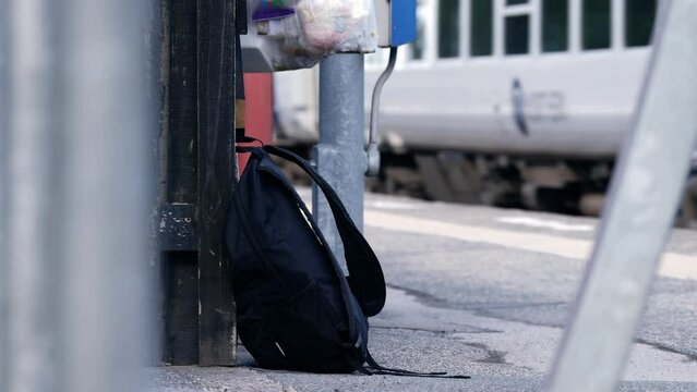 Suspicious rucksack left on railway platform as train goes by