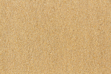 Fototapeta na wymiar Detail of texture of wet sand on the beach 