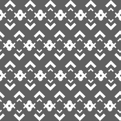 Vector. Grey and white abstract ethnic seamless pattern. Background of angle brackets. Mosaic. Design of packaging paper, textile printing, web design, cover, advertising and typographic products.