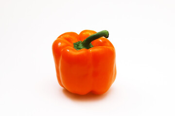 Orange pepper on a white background. Close-up
