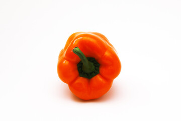 Orange pepper on a white background. Close-up