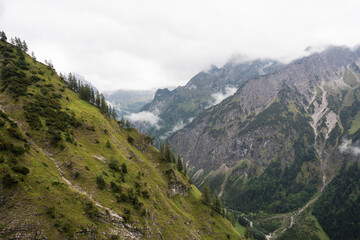 Fototapeta premium Panorama view over the Alps on a rainy morning