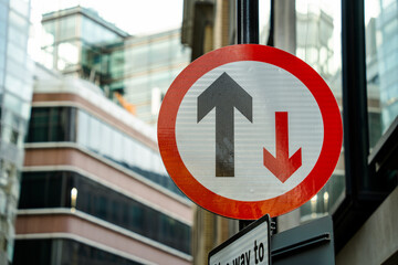 Priority sign in a downtown city setting
