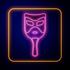 Glowing neon Carnival mask icon isolated on black background. Masquerade party mask. Vector
