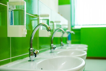 Children toilet in kindergarten or school. toilet in kindergarten bathroom in public area. inside...