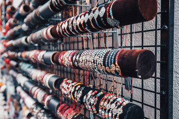 Trendy handmade bracelets and wristbands for sale at artisans market. Handcraft souvenir at flea...
