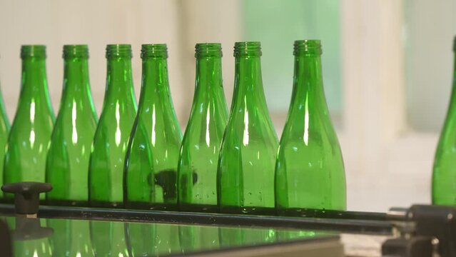 clear glass bottle with the cap open, isolated on White background. containers for bottling lemonade