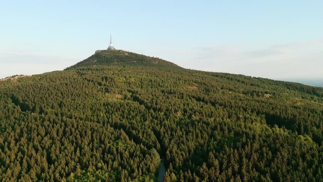 Jested Tower, Hotel, Restaurant and TV Tower in Liberec Czech Republic lit with sunset