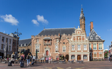 Fototapeta premium Market square with people and town hall in Haarlem, Netherlands