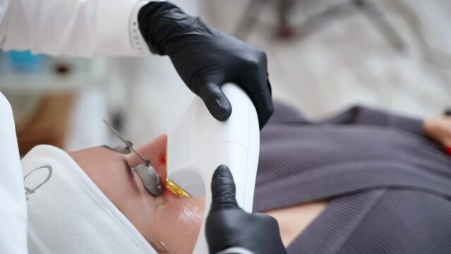 Woman undergoing facial phototherapy with BBL laser