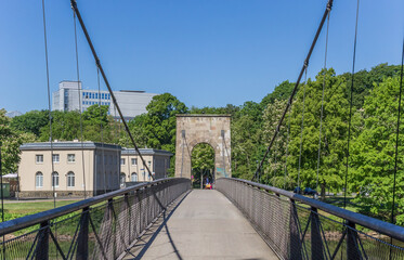 Suspension bridge leading to the Karlsaue park in Kassel, Germany