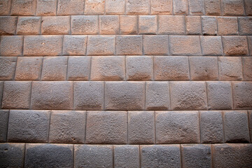Construction of Inca stones in the street of Cusco, in Peru