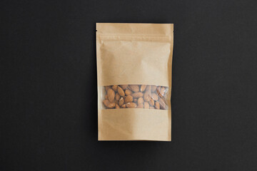 Almond in a package on a black background
