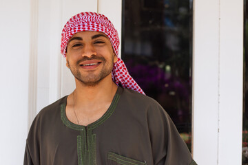 Happy young arab man smiling