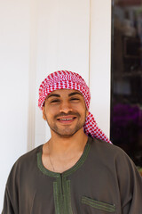 Portrait of a young arab man laughing