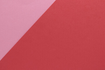 Two color, pink and red, textured paper background. Texture with blank space and copy space